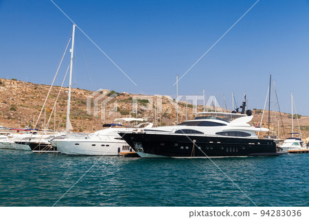 Yachts are anchored near Comino island, Malta Yachts are anchored near Comino island, Malta 94283036