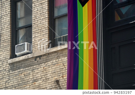 peace rainbow flag on new york city manhattan building 94283197