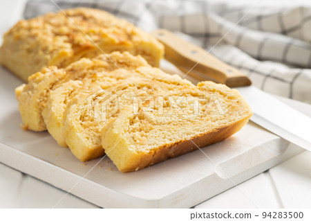 Sweet pie with nut flavor on cutting board. Sweet pie with nut flavor on cutting board. 94283500