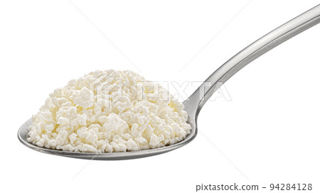 Cottage cheese in spoon isolated on white background Cottage cheese in spoon isolated on white background 94284128
