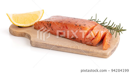 Artisanal smoked salmon on a cutting board Artisanal smoked salmon on a cutting board 94284199
