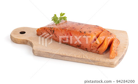 Artisanal smoked salmon on a cutting board Artisanal smoked salmon on a cutting board 94284200