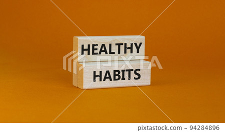 Time to healthy habits symbol. Concept words Healthy habits on wooden blocks on a beautiful yellow background. Business, medical and healthy habits concept. Copy space. Time to healthy habits symbol. Concept words Healthy habits on wooden blocks on a beautiful yellow background. Business, medical and healthy habits concept. Copy space. 94284896