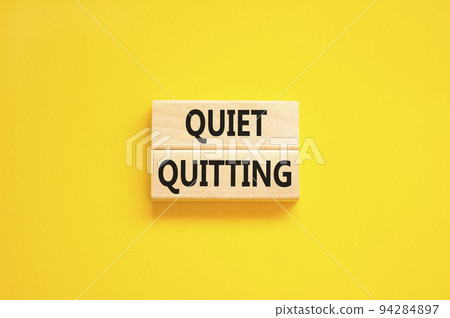 Quiet quitting symbol. Concept words Quiet quitting on wooden blocks. Beautiful yellow table yellow background. Business and quiet quitting concept. Copy space. Quiet quitting symbol. Concept words Quiet quitting on wooden blocks. Beautiful yellow table yellow background. Business and quiet quitting concept. Copy space. 94284897