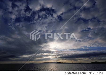 Coastal evening view in late summer with powerful clouds, super wide angle, mainly sky, 220907pm 94287451