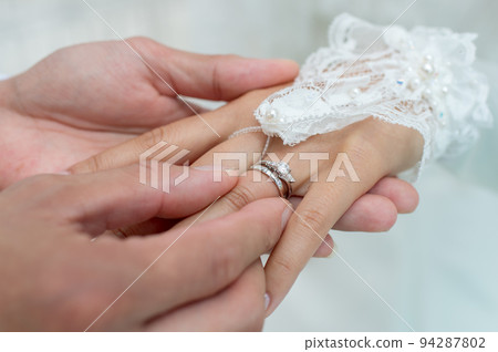 Ring exchange at the wedding ceremony 94287802