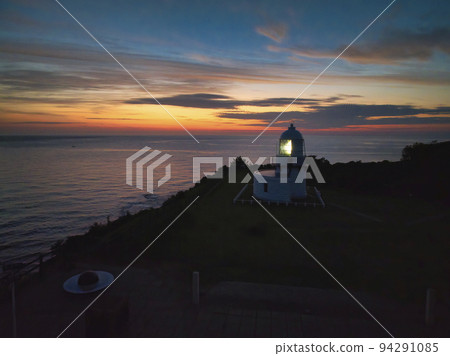 Beautiful sunrise and Rokkosaki lighthouse (lighthouse with beacon smoke) Suzu City, Ishikawa Prefecture (aerial shot by drone) Beautiful sunrise and Rokkosaki lighthouse (lighthouse with beacon smoke) Suzu City, Ishikawa Prefecture (aerial shot by drone) 94291085