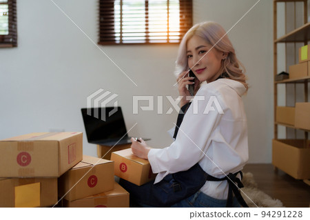Asian SME business woman working at home office. online shopping concept. Asian SME business woman working at home office. online shopping concept. 94291228
