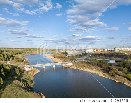 Beauriful sunset view along the Iset river and rocks in town Kamensk-Uralskiy. A scenic sunset at the river. Kamensk-Uralskiy, Sverdlovsk region, Ural mountains, Russia. Aerial view Beauriful sunset view along the Iset river and rocks in town Kamensk-Uralskiy. A scenic sunset at the river. Kamensk-Uralskiy, Sverdlovsk region, Ural mountains, Russia. Aerial view 94291556