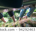 People stretching their legs from the bridge 94292463