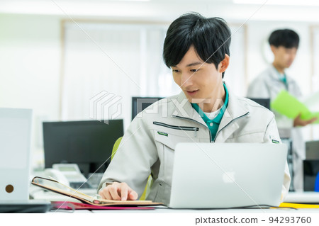 Young engineer working in the office Young engineer working in the office 94293760