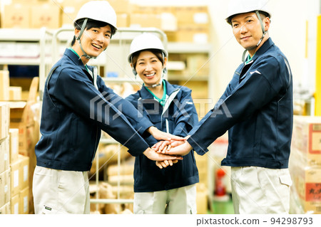Logistic employees who are united by teamwork Logistic employees who are united by teamwork 94298793