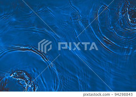 transparent dark blue colored clear calm water surface texture  94298843