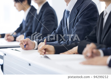 Seminar Hands of young men and women in suits 94299212