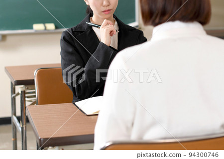 Teacher and student having an interview Teacher and student having an interview 94300746