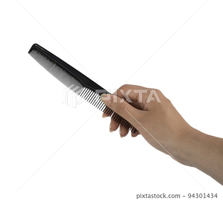 a comb in the female hand  94301434