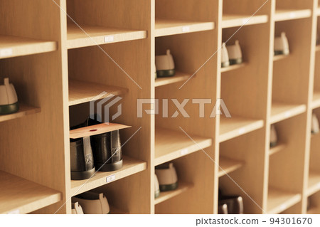 Entrance after school / Shoe box, shoes and letters illuminated by the setting sun / School location / Image of youth and nostalgia 94301670