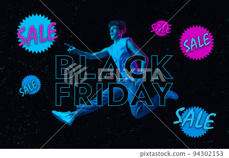 Creative art design. Conceptual image. Young stylish man jumping over black background in neon light. Black Friday sales 94302153