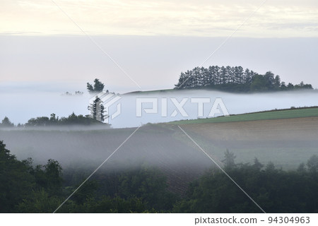 Morning glow and Asagiri hills in Biei in September 94304963