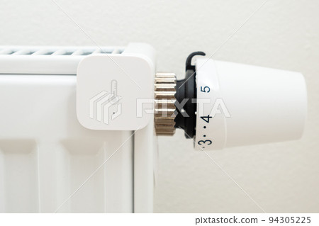 Smart heat sensor on the battery for temperature control. The increasing price of gas and heating concept 94305225