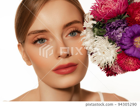 Portrait of young beautiful girl with well-kept skin and light daily makeup isolated on white background. Beauty, spa, cosmetics, face lifting and skin care concept 94305290