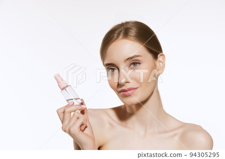 Closeup portrait of beautiful young girl with clean well-kept skin isolated over white background. Skin care. Facial treatment. Cosmetology, beauty and spa. 94305295