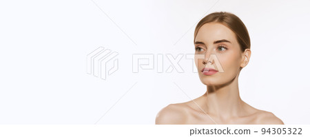 Portrait of young female fashion model with nude makeup isolated on white studio background. Spa, surgery, face lifting and skin care concept 94305322