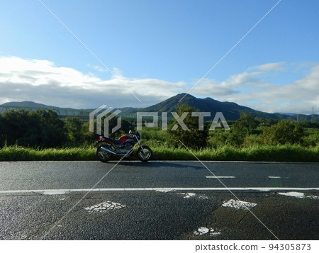 Scenery with a motorcycle after the rain Scenery with a motorcycle after the rain 94305873