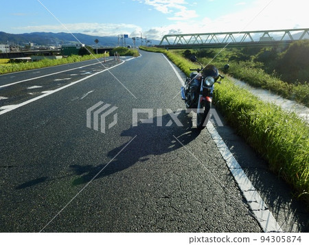 Scenery with a motorcycle after the rain 94305874