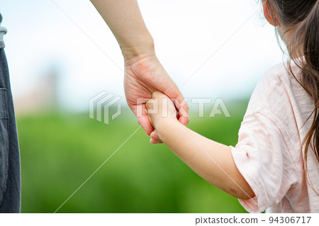Parent and child connecting hands Parent and child connecting hands 94306717