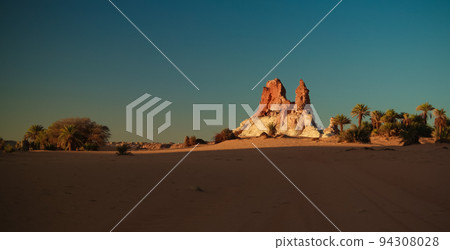 Sunrise at sandstone formation in the Sahara desert near Yoa Lake group of Ounianga Kebir, Ennedi, Chad Sunrise at sandstone formation in the Sahara desert near Yoa Lake group of Ounianga Kebir, Ennedi, Chad 94308028