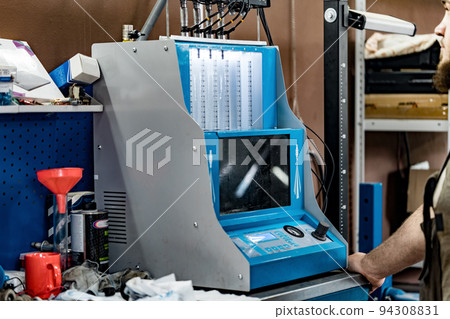 Fuel injector cleaner and tester machine at car service station 94308831