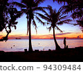 sunset beach silhouette 94309484