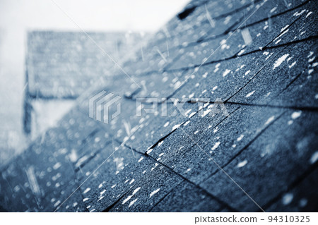 it is snowing above the shingle roof it is snowing above the shingle roof 94310325