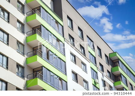 Apartment building with modern architecture in city downtown Apartment building with modern architecture in city downtown 94310444