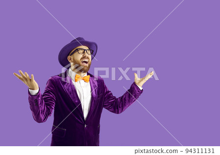 Happy eccentric man isolated on purple background laughing out loud after hearing funny joke Happy eccentric man isolated on purple background laughing out loud after hearing funny joke 94311131