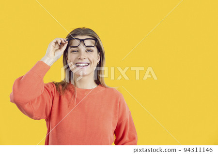 Smiling girl take off glasses think of promotion Smiling girl take off glasses think of promotion 94311146