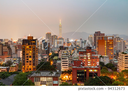 Twilight aerial view of the Zhongzheng District cityscape 94312673