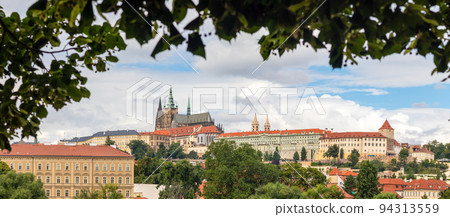 Hradcany - the Prague castle, view framed by tree foliage, Czech republic Hradcany - the Prague castle, view framed by tree foliage, Czech republic 94313559