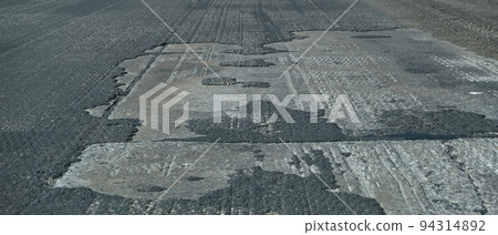 Old asphalt. Budget repair the road. Broken Old asphalt. Budget repair the road. Broken 94314892