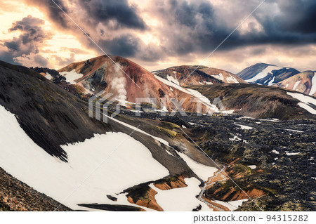 Volcanic mountain with snow covered on Blahnjukur trail in Icelandic highlands on summer at Landmannalaugar, Iceland 94315282