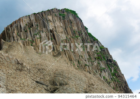 amazing landscape of columnar volcanic basalt rocks on the island of Kunashir amazing landscape of columnar volcanic basalt rocks on the island of Kunashir 94315464