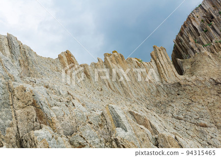 amazing landscape of columnar volcanic basalt rocks on the island of Kunashir 94315465