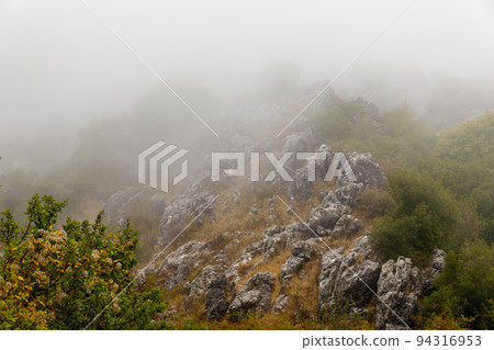 Landscape in the clouds under Mount Pantokrator on the island of Corfu Landscape in the clouds under Mount Pantokrator on the island of Corfu 94316953