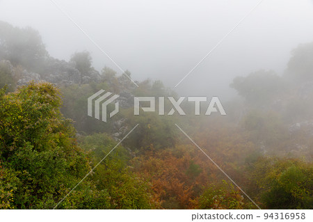Landscape in the clouds under Mount Pantokrator on the island of Corfu Landscape in the clouds under Mount Pantokrator on the island of Corfu 94316958