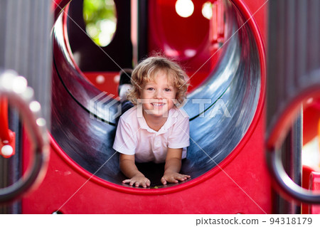 Child on playground. Kids play outdoor. 94318179