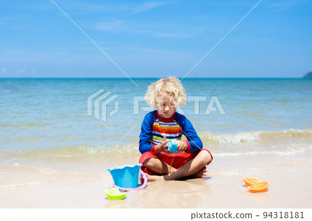 Kids playing on beach. Children play at sea. 94318181