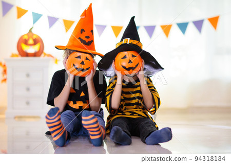 Kids in witch costume on Halloween trick or treat Kids in witch costume on Halloween trick or treat 94318184