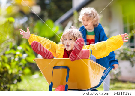 Kids on pumpkin patch. Child autumn outdoor fun. Kids on pumpkin patch. Child autumn outdoor fun. 94318185