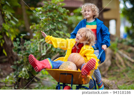 Kids on pumpkin patch. Child autumn outdoor fun. Kids on pumpkin patch. Child autumn outdoor fun. 94318186